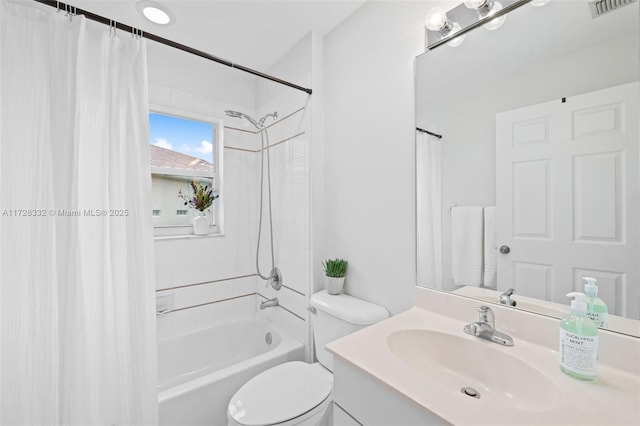 full bathroom featuring toilet, vanity, and shower / bath combo with shower curtain