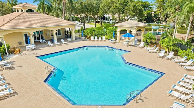 view of swimming pool featuring a gazebo and a patio area