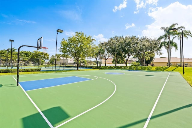 view of sport court featuring tennis court