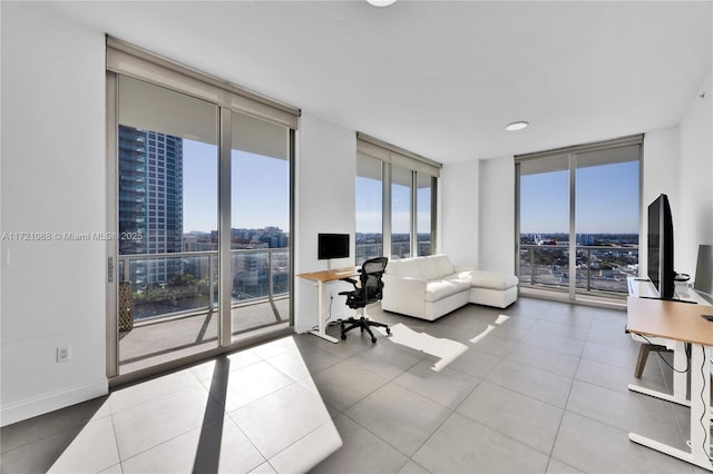 living room featuring tile patterned floors and expansive windows