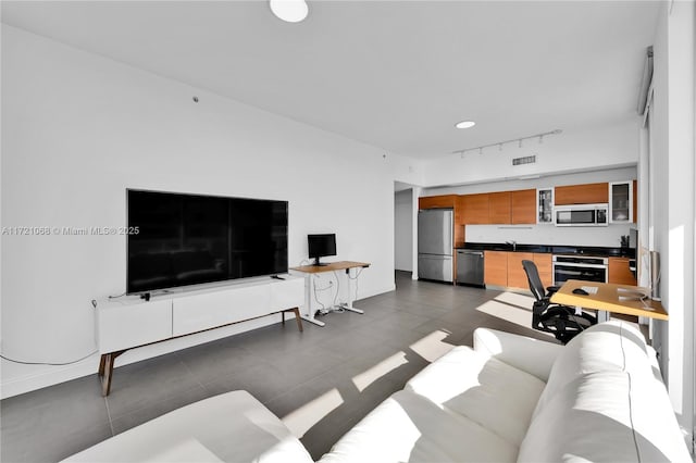 tiled living room with track lighting