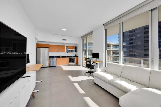 living room with floor to ceiling windows