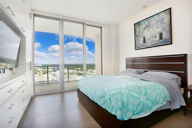 bedroom featuring access to exterior and floor to ceiling windows