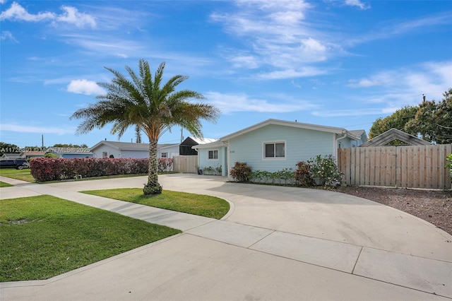 ranch-style house with a front lawn