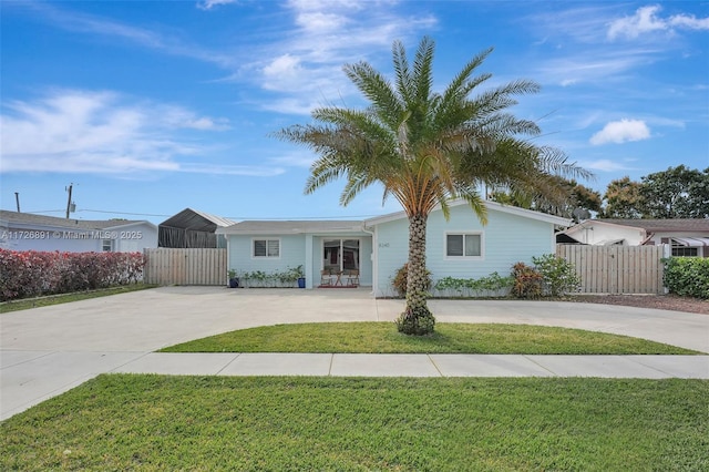 ranch-style house with a front lawn