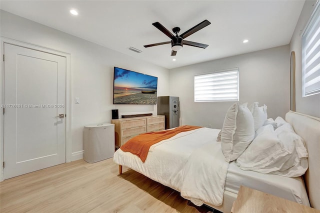 bedroom featuring ceiling fan and light hardwood / wood-style floors