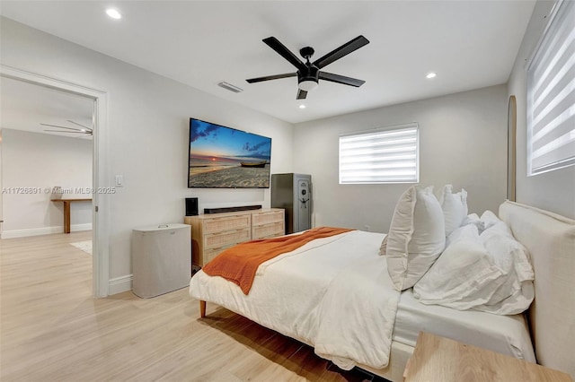 bedroom featuring ceiling fan and light hardwood / wood-style flooring