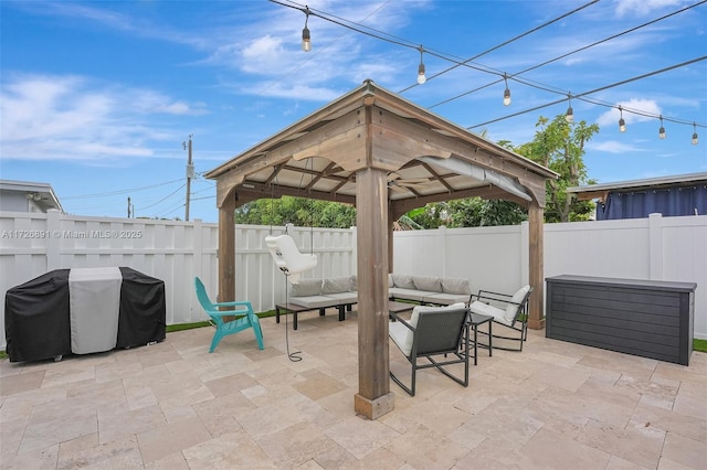 view of patio featuring an outdoor hangout area, a gazebo, and area for grilling