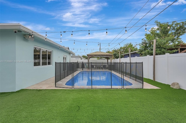 view of pool featuring a patio area, a gazebo, and a yard