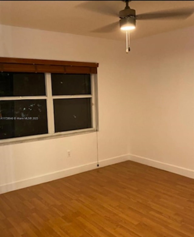 unfurnished room featuring ceiling fan and hardwood / wood-style floors