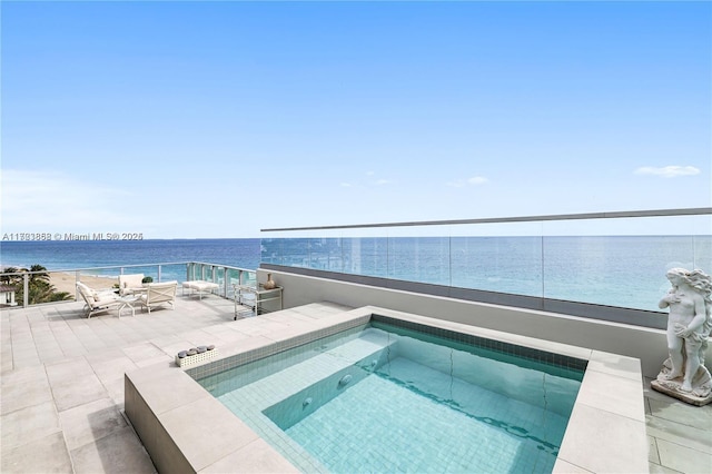 view of swimming pool featuring a water view