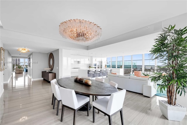 dining space featuring an inviting chandelier and a wealth of natural light