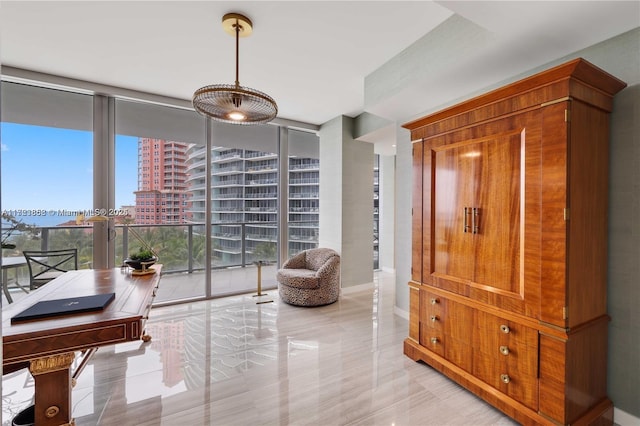 living area with floor to ceiling windows