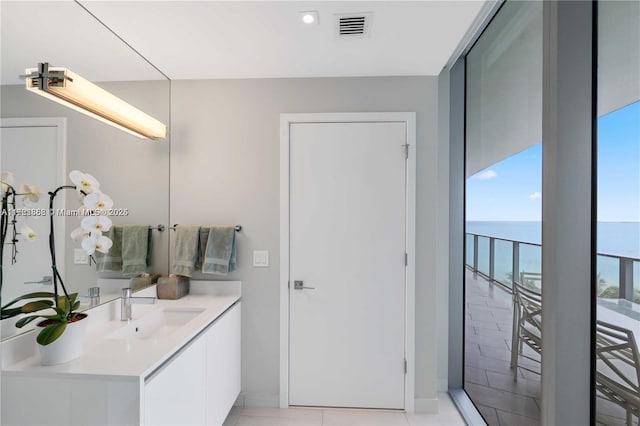 bathroom featuring vanity and a water view