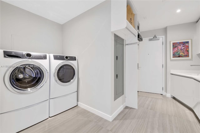 clothes washing area with washer and dryer