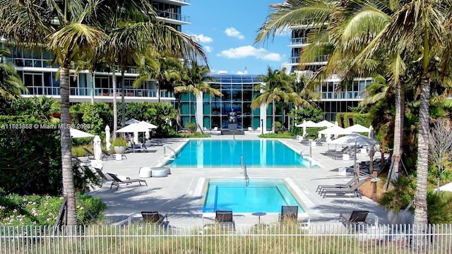 view of swimming pool with a patio