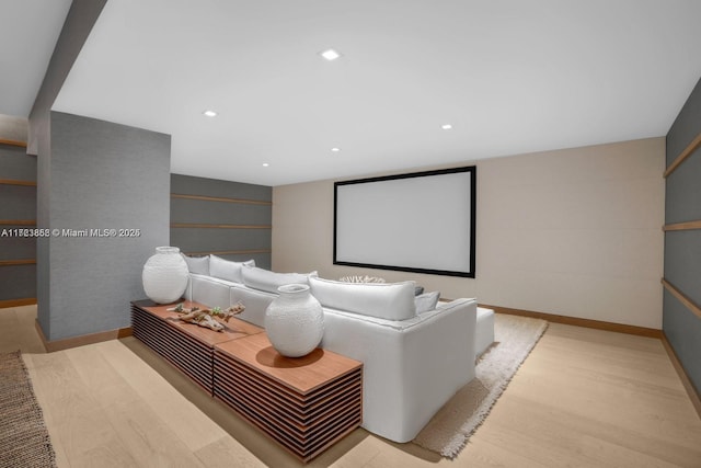 home theater room featuring light hardwood / wood-style flooring