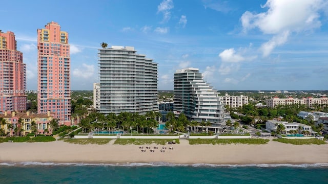 exterior space featuring a view of the beach and a water view