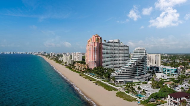 birds eye view of property featuring a view of the beach and a water view