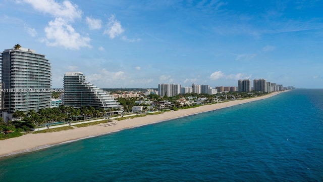 drone / aerial view featuring a view of the beach and a water view