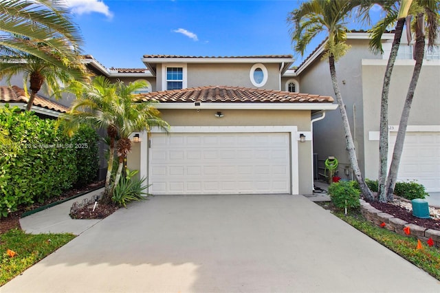 mediterranean / spanish-style home featuring a garage