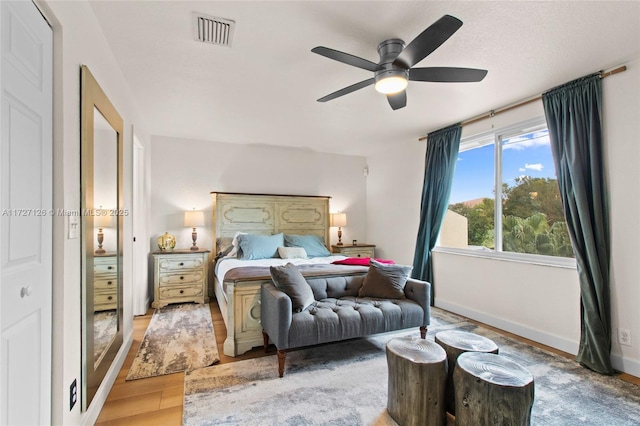 bedroom featuring ceiling fan and wood-type flooring