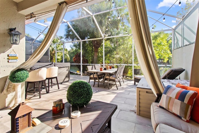 view of patio / terrace with a lanai and an outdoor living space