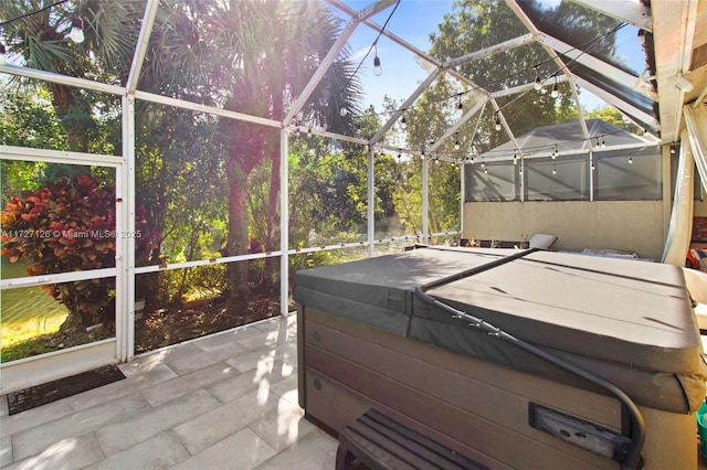 sunroom / solarium with a hot tub