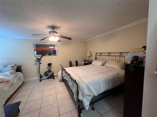 bedroom with ceiling fan, a textured ceiling, light tile patterned floors, and crown molding