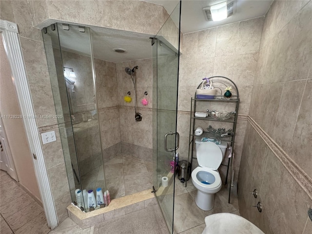 bathroom featuring toilet and walk in shower