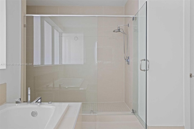 bathroom with separate shower and tub