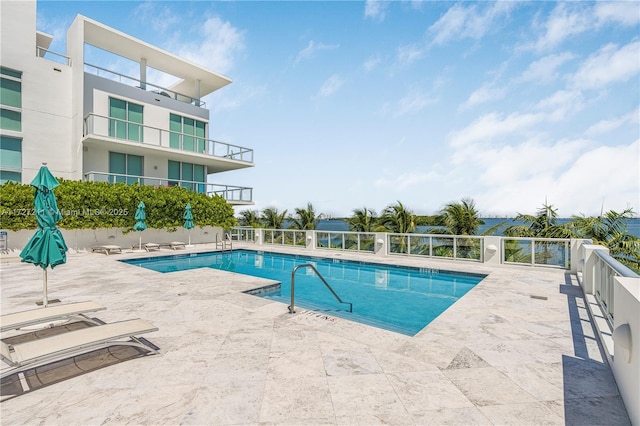 view of swimming pool with a patio