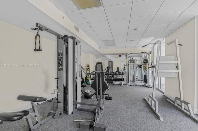 workout area featuring a drop ceiling