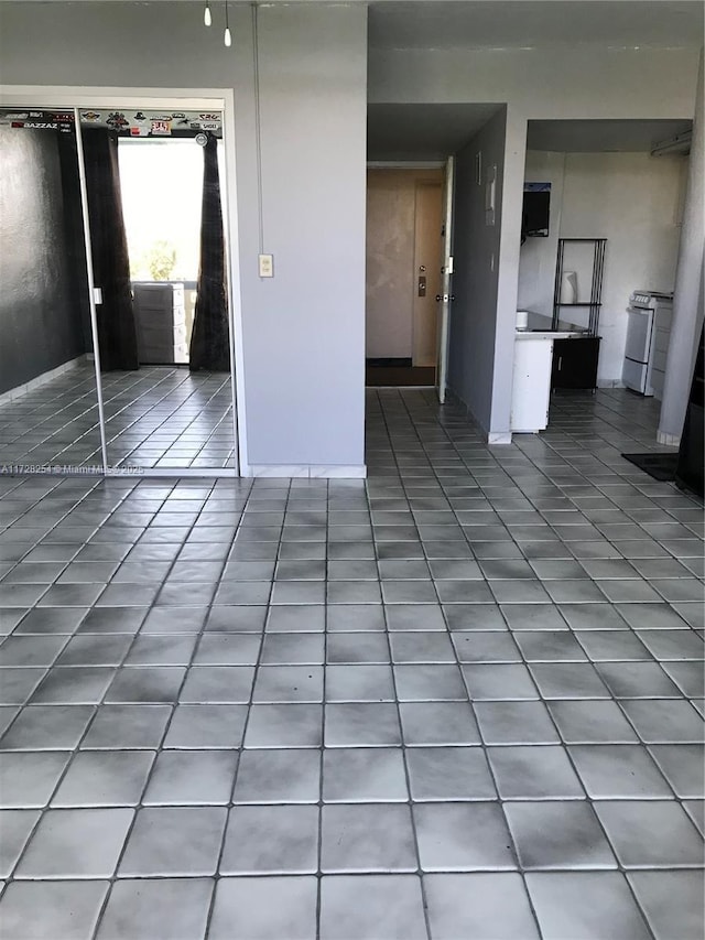 unfurnished living room with tile patterned floors