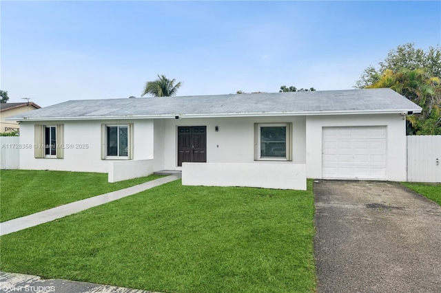 single story home with a garage and a front yard