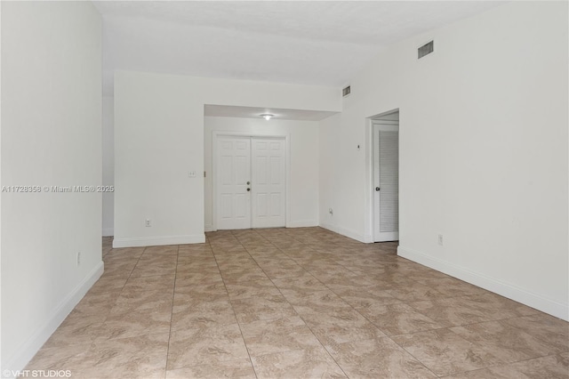 spare room with lofted ceiling