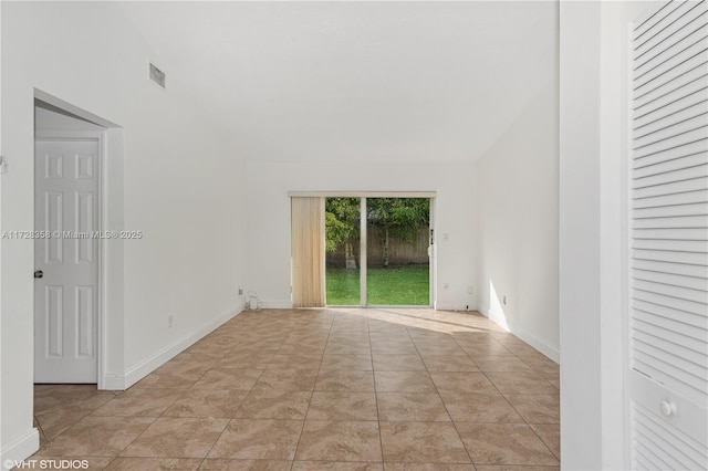 unfurnished room with light tile patterned floors