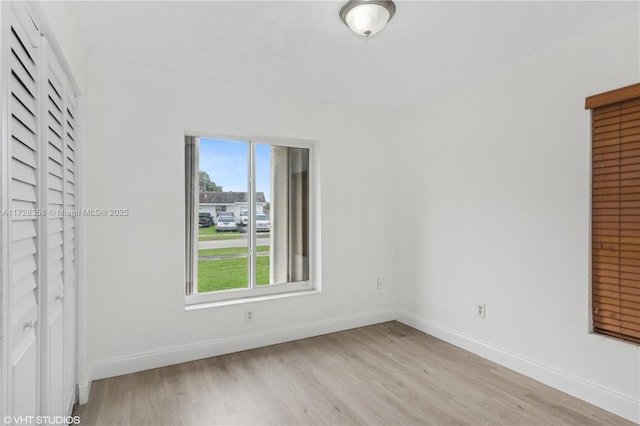 spare room with light hardwood / wood-style floors