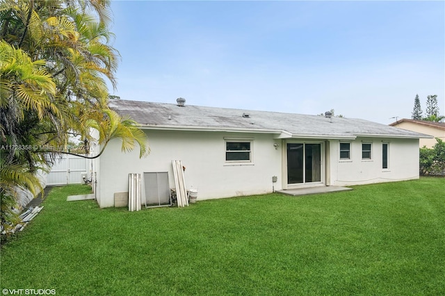11030 SW 165th Ter, Miami, FL 33157 - rear view of property with stucco siding and a yard