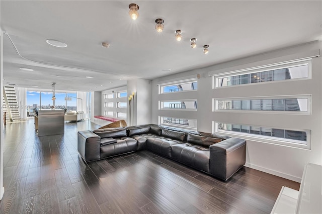 living room with dark hardwood / wood-style flooring