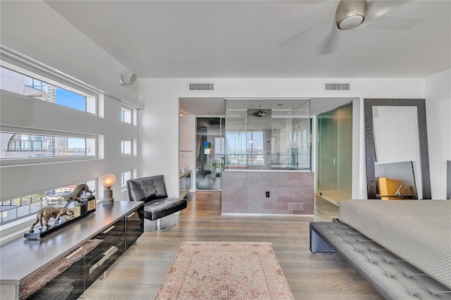 living room with ceiling fan and hardwood / wood-style floors