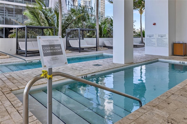 view of swimming pool with a patio