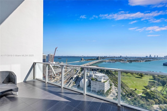 balcony featuring a water view