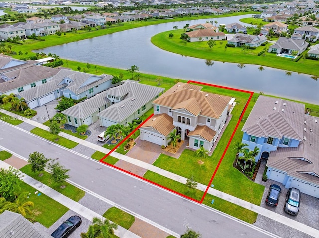 birds eye view of property featuring a water view