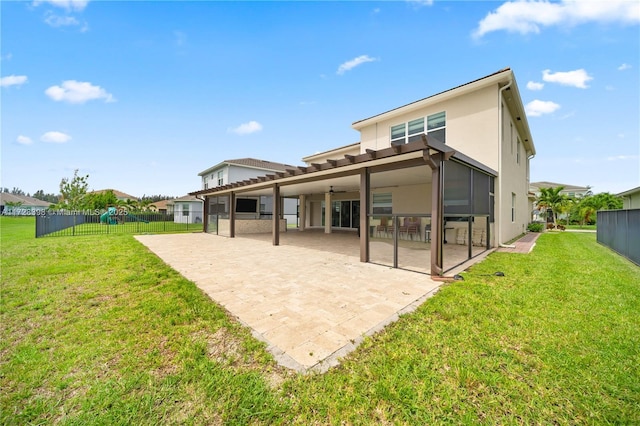 back of house featuring a yard and a patio