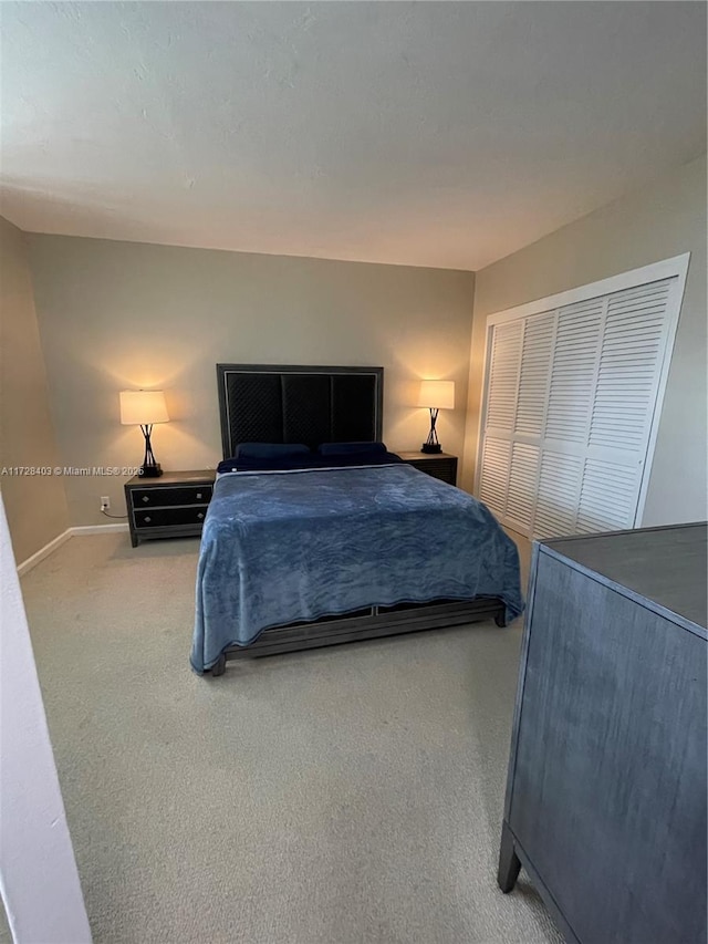 bedroom with a closet and carpet flooring