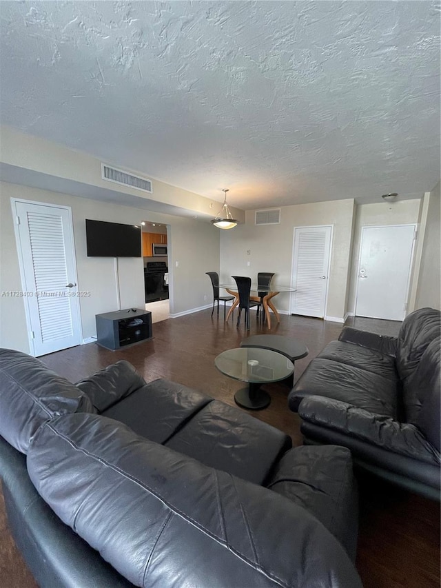 living room with a textured ceiling