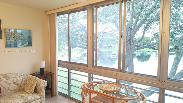 sunroom / solarium with a water view