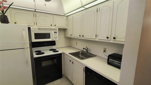 kitchen with black appliances, light tile patterned floors, and sink