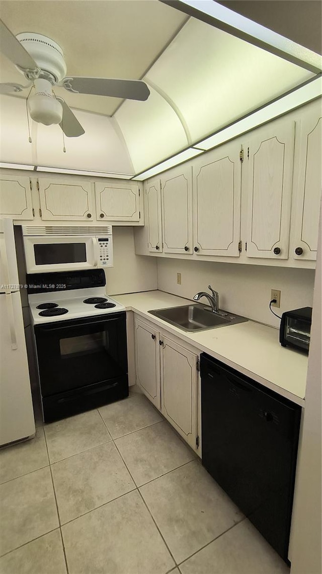 kitchen with black appliances, light tile patterned floors, ceiling fan, and sink